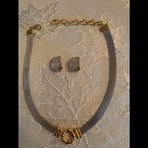 Gold and silver accented clip earrings and matching necklace.